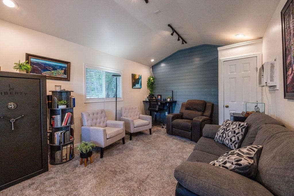 384 Fort Graham Road, Waco, TX 76705 Sloped ceiling with track lighting, textured accent wall, and recessed lighting