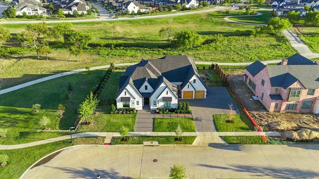 4301 Corabelle Lane, Prosper, TX 75078 White exterior with dark trim and multiple gables
