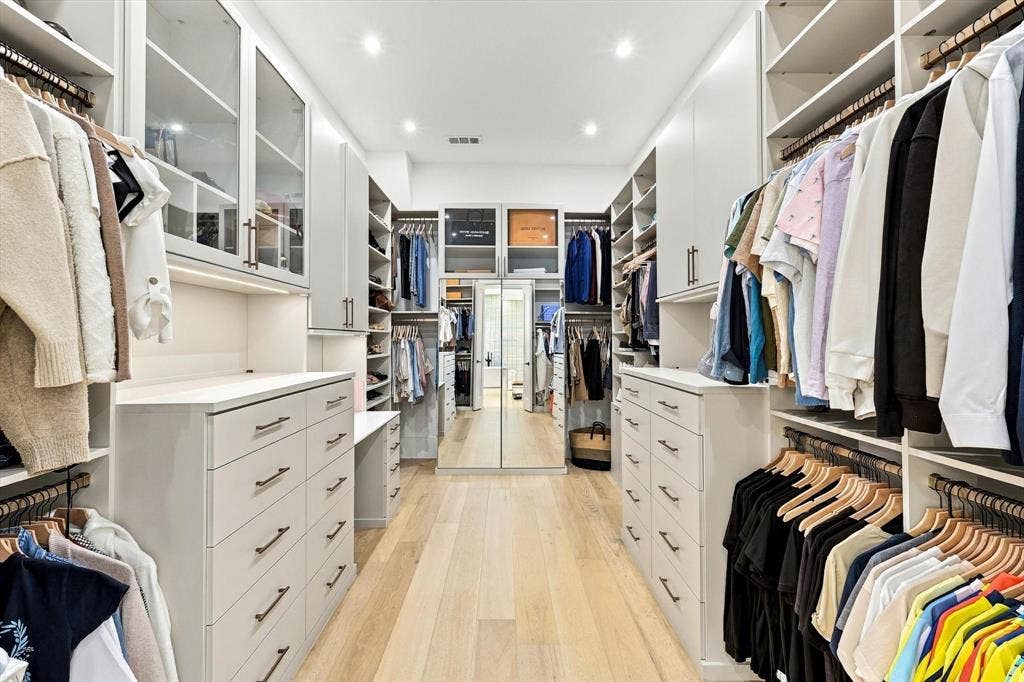 4301 Corabelle Lane, Prosper, TX 75078 Custom built-in closet system with extensive shelving, drawer storage, and hanging rods