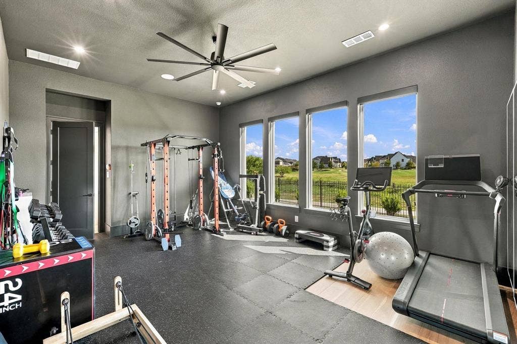 4301 Corabelle Lane, Prosper, TX 75078 Spacious room featuring three large windows, recessed lighting, a ceiling fan, and a neutral wall color