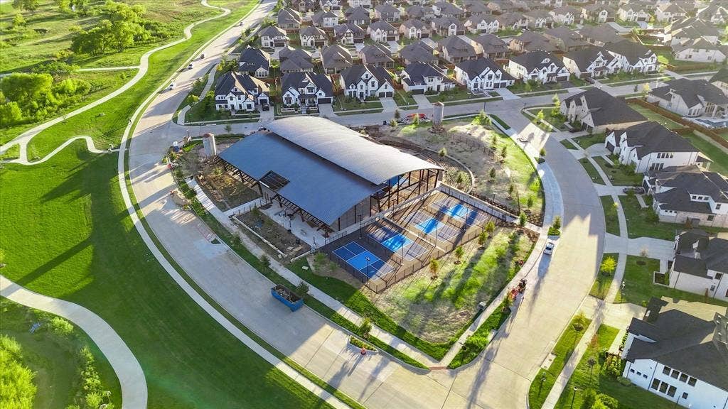 4301 Corabelle Lane, Prosper, TX 75078 Community recreation center featuring covered courts and surrounding green spaces