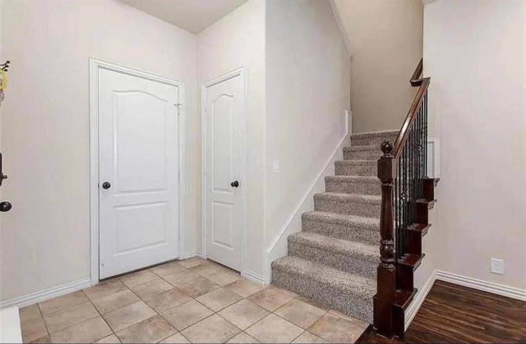 Stairway featuring tile patterned flooring