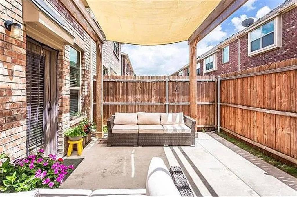 View of patio with an outdoor hangout area