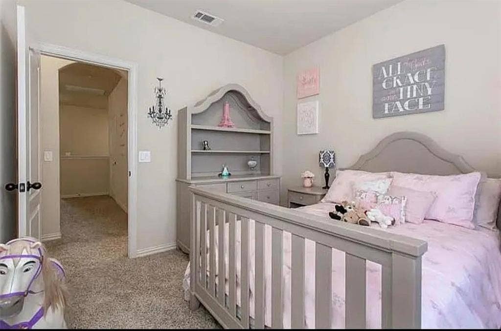 Bedroom with light colored carpet