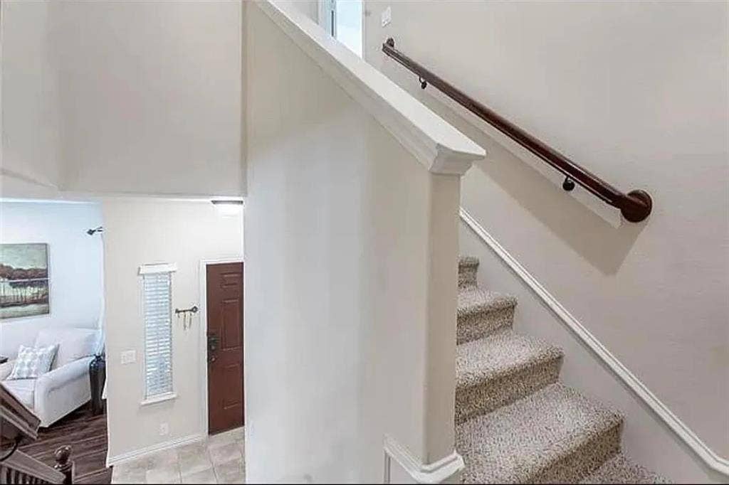 Staircase with tile patterned flooring