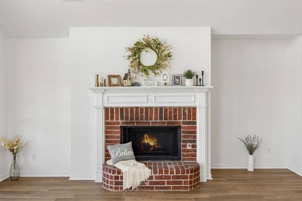 Love the warmth of the fireplace, the richness of the Luxury Vinyl Plank Flooring, and the built in niche for your special furniture!