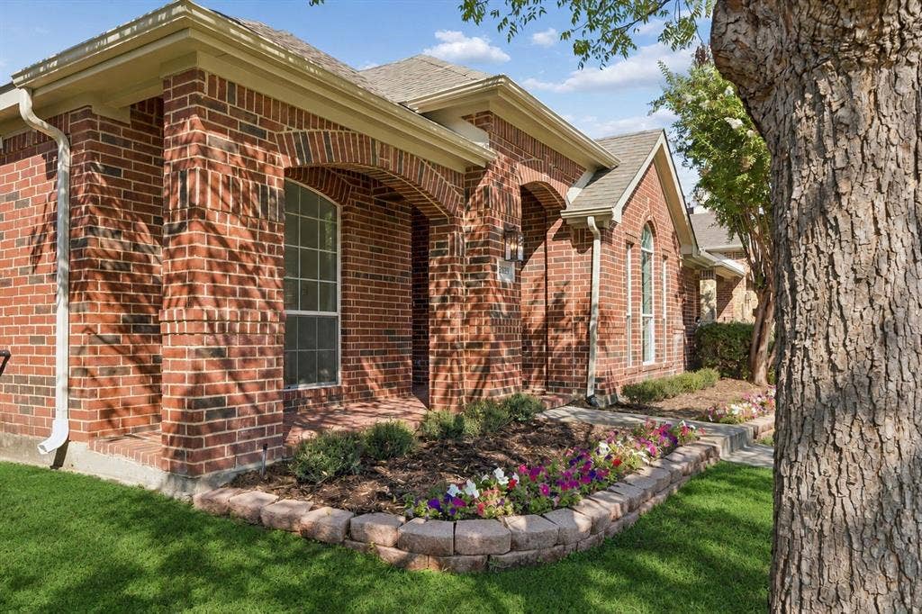 This charming brick Highland built home is surrounded by mature shade trees, inviting brick front porch, and beautifully maintained flower beds...