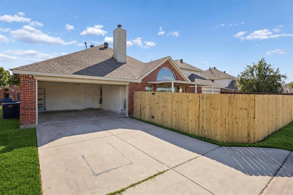 This convenient rear-entry garage is spacious and will hold two cars and tools - with easy access to the backyard.
