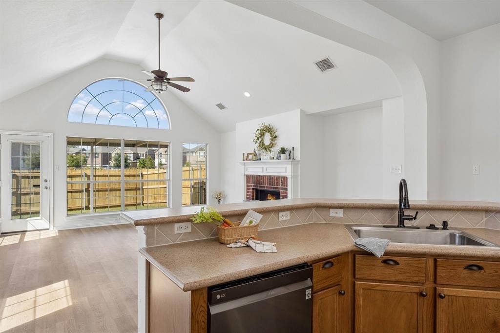 Just another awesome look at the expansive and breathtaking windows, vaulted ceiling and warm and inviting fireplace in the Living area... WOW!  So Inviting!