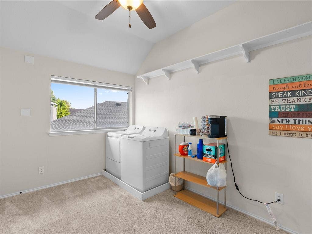3303 Felicia Court, McKinney, TX 75070 Utility room featuring vaulted ceilings, a large window, wall-mounted shelving, and a ceiling fan