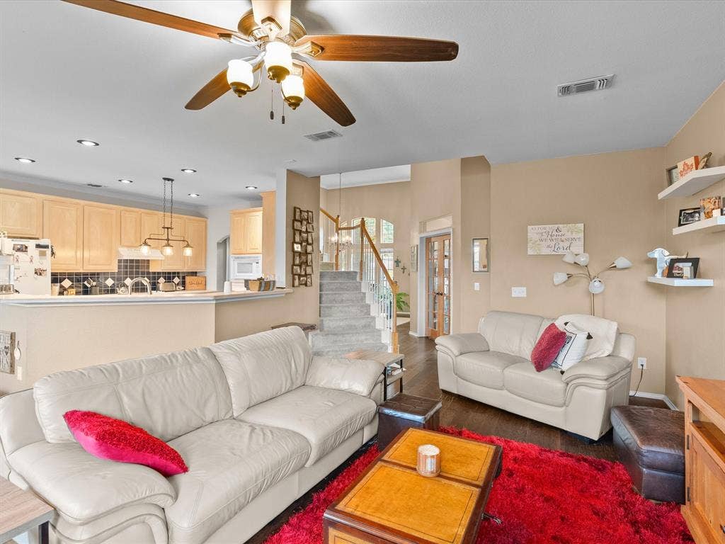 3303 Felicia Court, McKinney, TX 75070 Open-concept kitchen featuring light wood cabinetry, recessed lighting, and a breakfast bar
