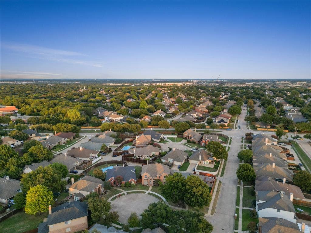 3303 Felicia Court, McKinney, TX 75070 Aerial perspective of a suburban neighborhood featuring mature trees, paved streets, cul-de-sac layouts, and detached single-family residences with fenced backyards