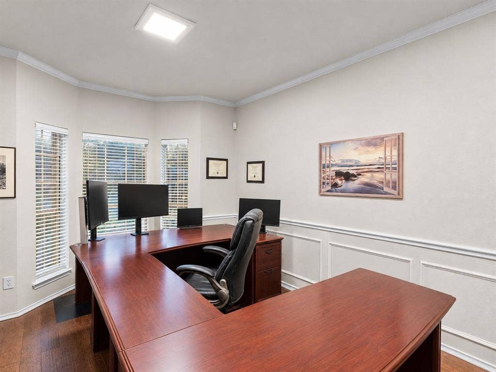 3303 Felicia Court, McKinney, TX 75070 Bay window featuring multi-pane windows with horizontal blinds, wood-finish flooring, and lower-wall wainscoting