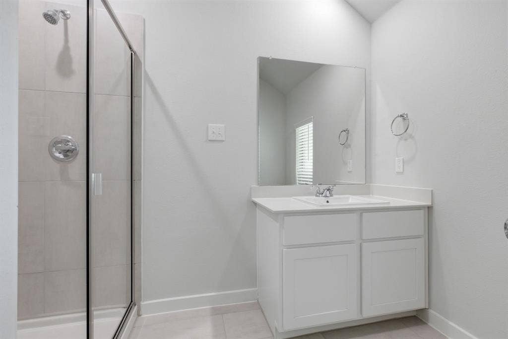 637 Sierra Ridge, Lavon, TX 75166 White vanity with a single basin sink, chrome faucet, and rectangular mirror