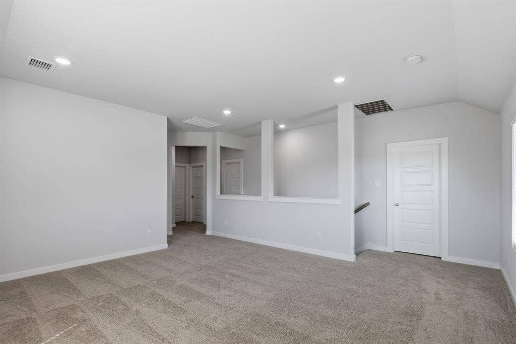 637 Sierra Ridge, Lavon, TX 75166 Recessed lighting, light gray wall finishes, light carpeting, white trim, and a paneled white door