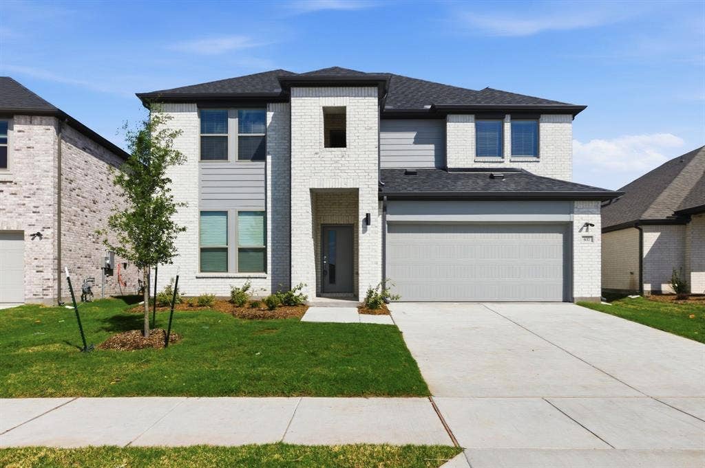 637 Sierra Ridge, Lavon, TX 75166 Two-story exterior with white brick and gray siding accents