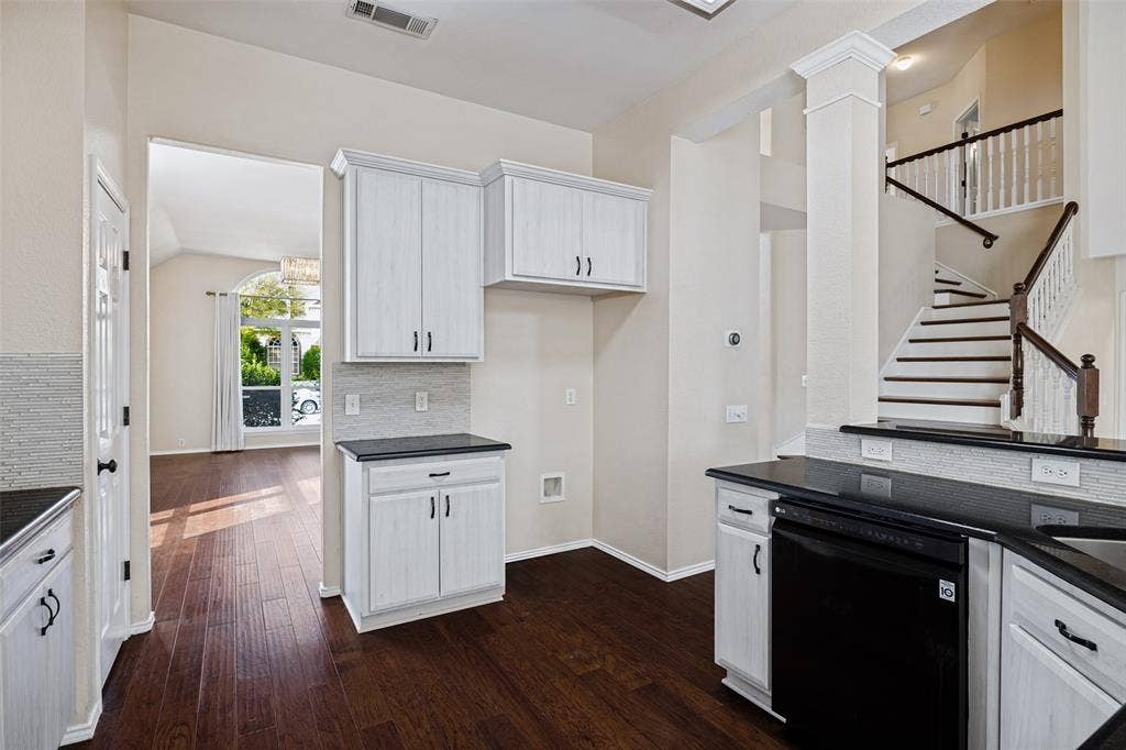 Kitchen featuring new cabinets and granite counters