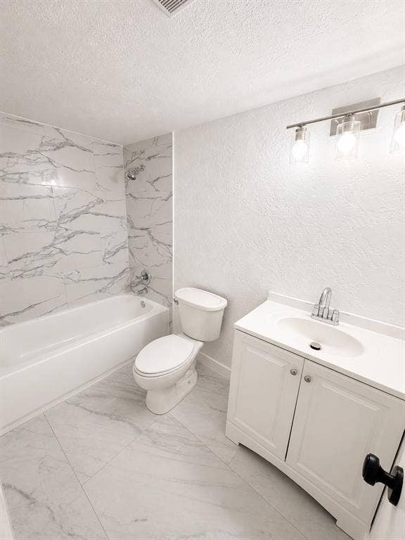 542 Hanover Drive, Allen, TX 75002 Bathroom featuring a white bathtub, toilet, and vanity with an integrated sink