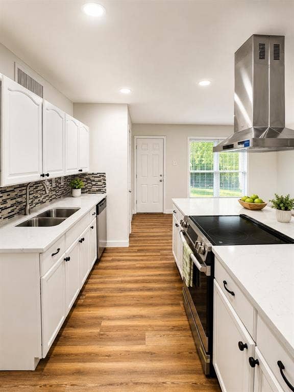 542 Hanover Drive, Allen, TX 75002 Kitchen featuring white cabinetry, wood-finish flooring, recessed lighting, and a stainless steel range hood