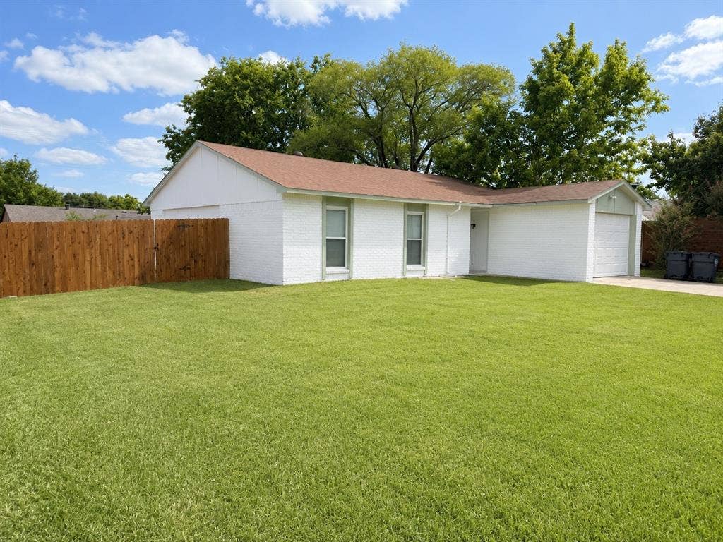 542 Hanover Drive, Allen, TX 75002 White brick residence featuring a brown asphalt shingle roof and an attached garage