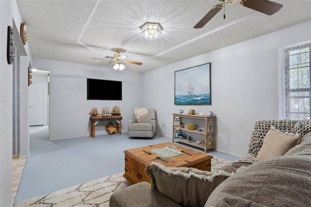 204 Ausborn Street, Eddy, TX 76524 Recessed lighting, ceiling fans, and window with natural light