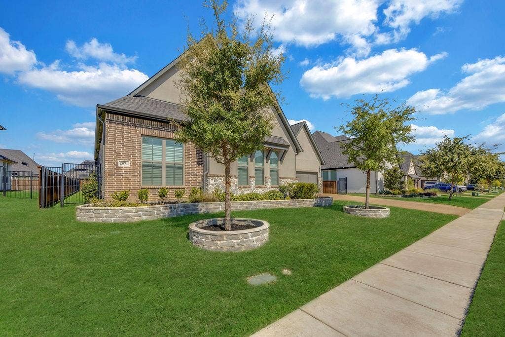 2971 Gaulding Drive, Prosper, TX 75078 Brick and stucco exterior with multiple gables