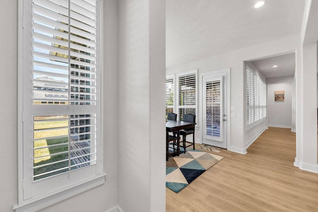 2971 Gaulding Drive, Prosper, TX 75078 Plantation shutters, light wood-finish flooring, recessed lighting, white trim, and a white interior door