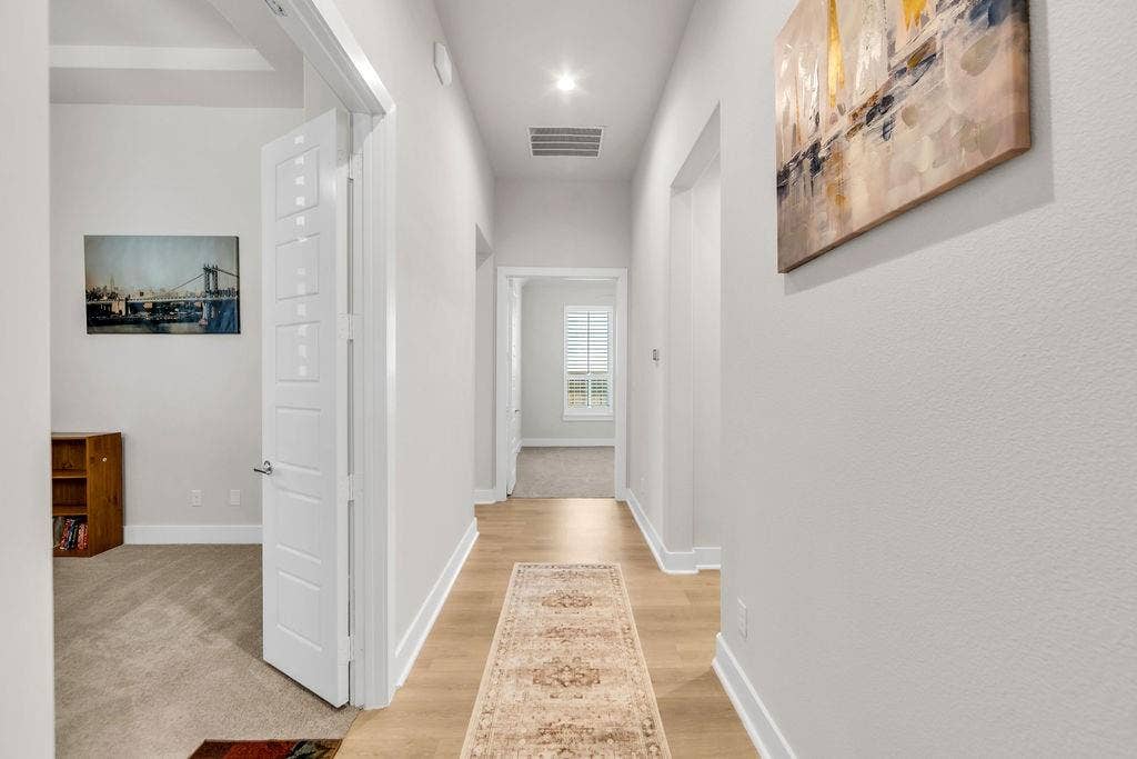 2971 Gaulding Drive, Prosper, TX 75078 Recessed lighting illuminates wood-finish flooring