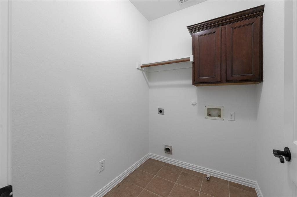 8617 Trolley Trail, McKinney, TX 75070 Utility room is conveniently located near the bedrooms.