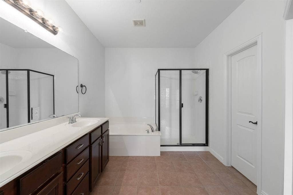 8617 Trolley Trail, McKinney, TX 75070 Primary ensuite with separate walk-in shower.