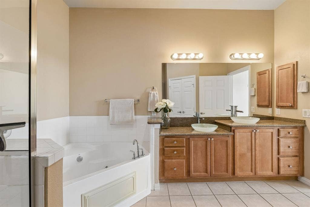 Your own relaxing retreat! Enjoy a soaking tub, separate shower, and dual sinks.