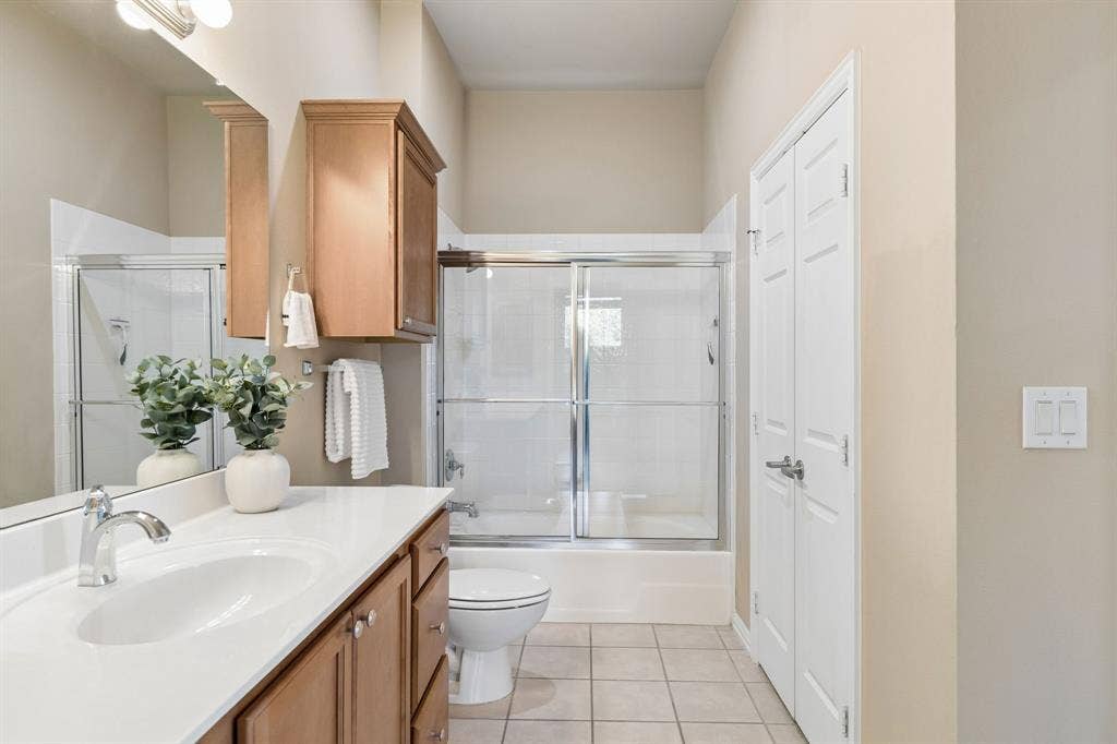Fresh, functional, and inviting, with vanity storage and a convenient full bath.