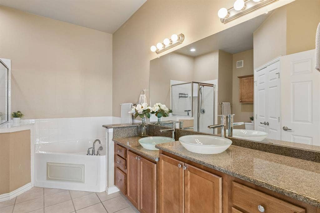 Two sinks, generous counter space, and room to get ready without feeling crowded!