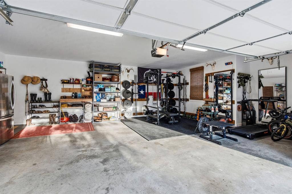 316 Zion Forest Trail, Poolville, TX 76487 Oversized garage is approx 26 ft wide X 24 ft deep. Your truck will fit!