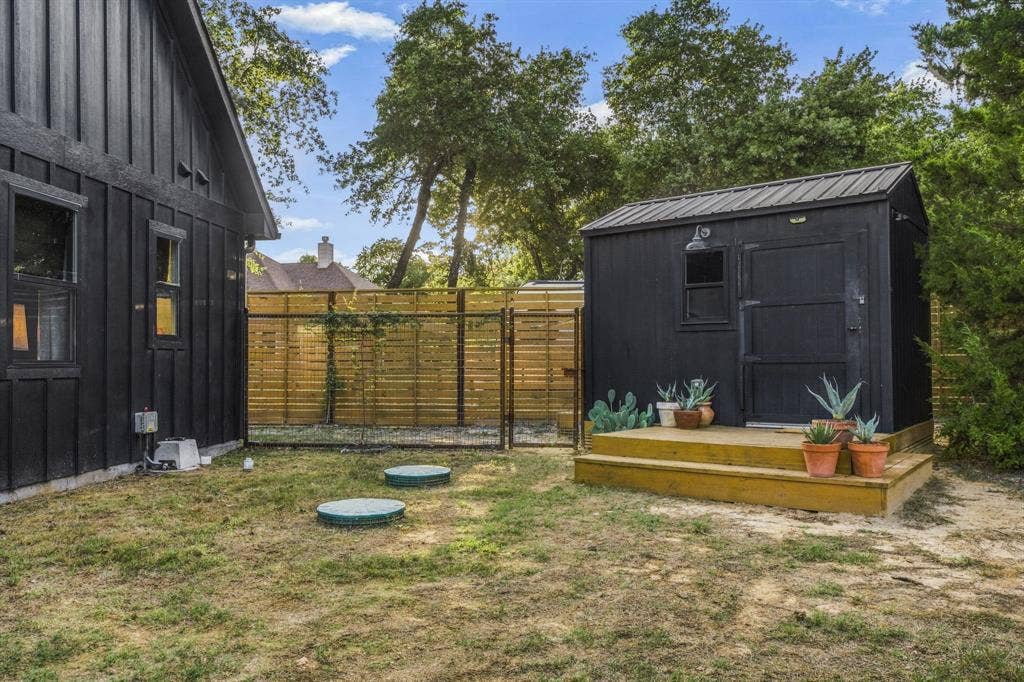 316 Zion Forest Trail, Poolville, TX 76487 Outbuilding with electric, storage and climate controlled dog kennel