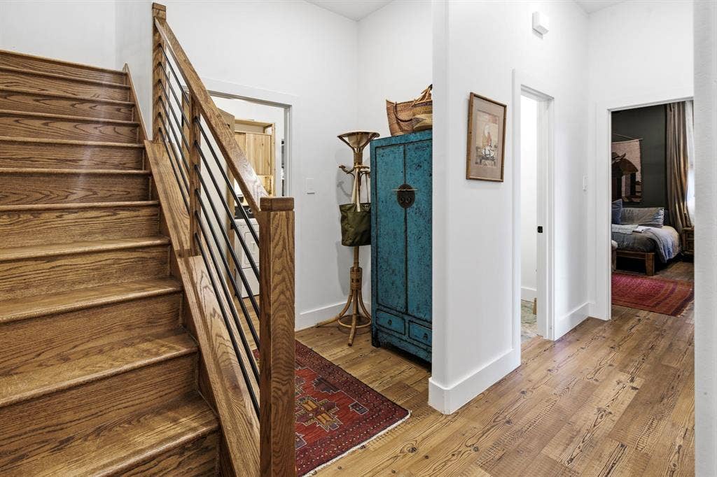 316 Zion Forest Trail, Poolville, TX 76487 Hallway with stairs and half bath