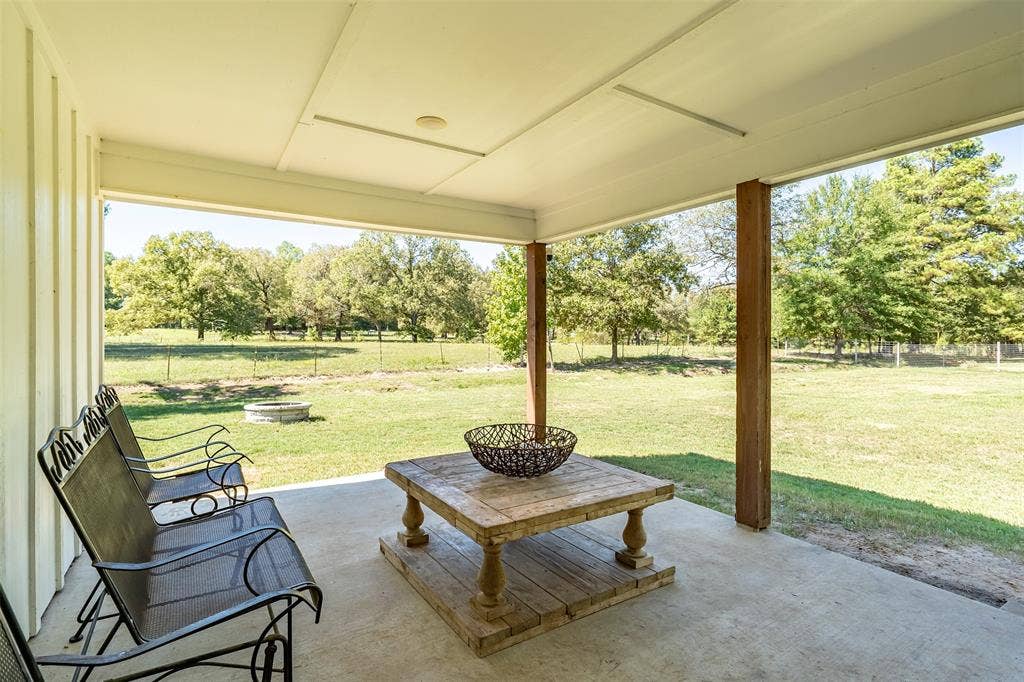 19731 County Road 4130, Lindale, TX 75771 Covered concrete patio with wood-finish support columns