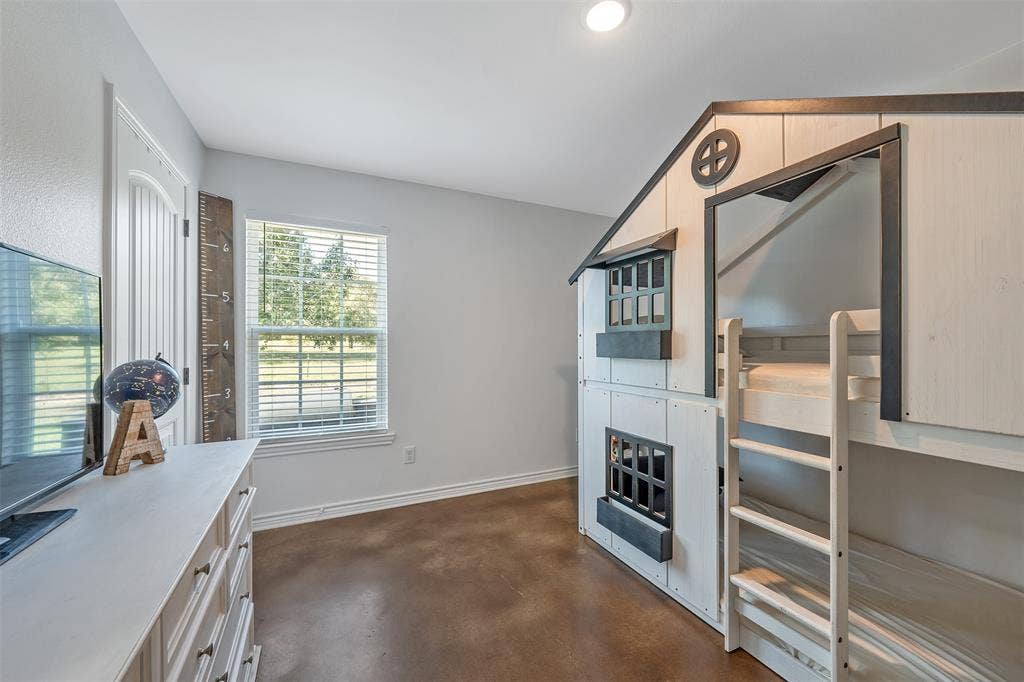 19731 County Road 4130, Lindale, TX 75771 Window with horizontal blinds, built-in bunk bed structure, wood-finish flooring, white trim details, and recessed ceiling lighting