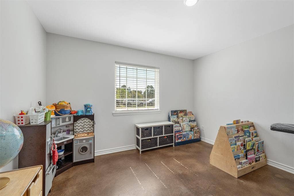19731 County Road 4130, Lindale, TX 75771 Recessed ceiling lighting, a single window with blinds, and stained concrete flooring