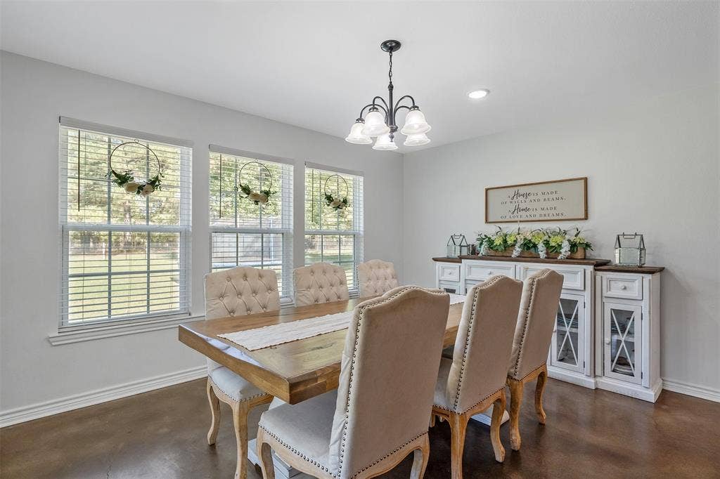 19731 County Road 4130, Lindale, TX 75771 Recessed lighting, dark wood-finish flooring, multiple windows with blinds, and a traditional chandelier with frosted glass shades