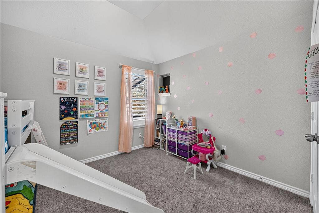 1416 White Squall Trail, Arlington, TX 76005 Carpeted flooring, vaulted ceiling, and window with blinds