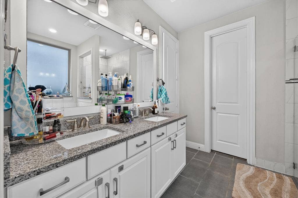 1416 White Squall Trail, Arlington, TX 76005 Dual vanity with granite countertops, undermount sinks, and white cabinetry