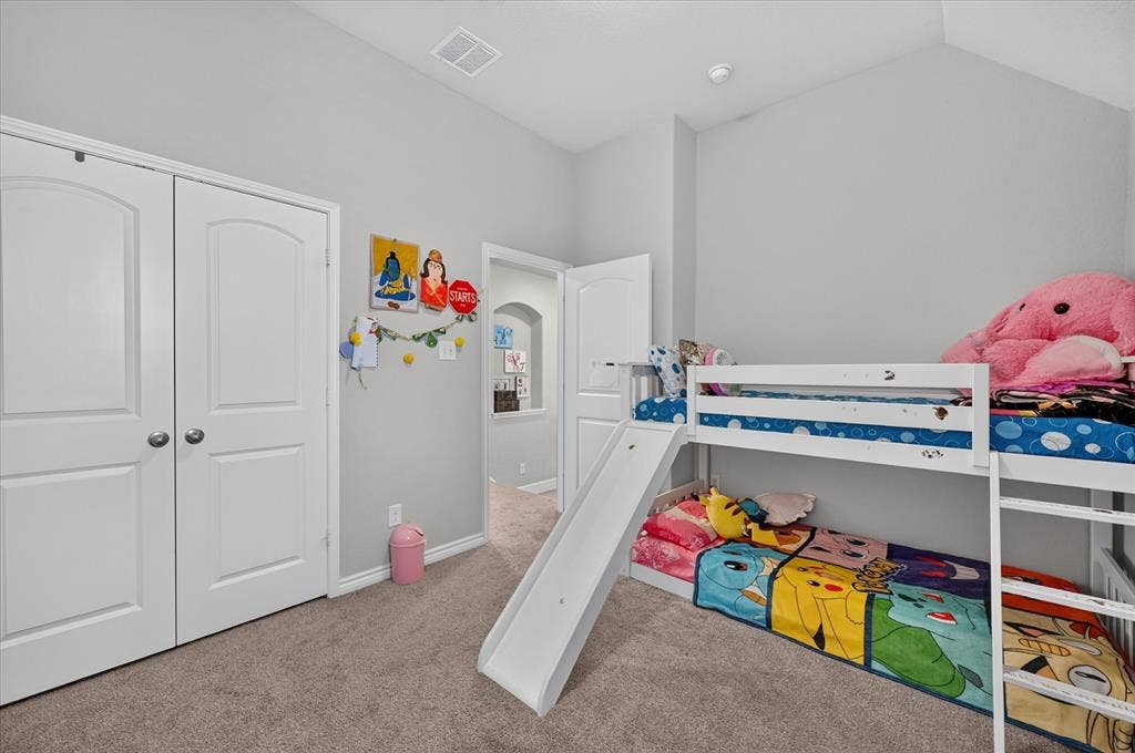 1416 White Squall Trail, Arlington, TX 76005 Carpeted flooring, vaulted ceiling, white trim, archway entry, and double-door closet
