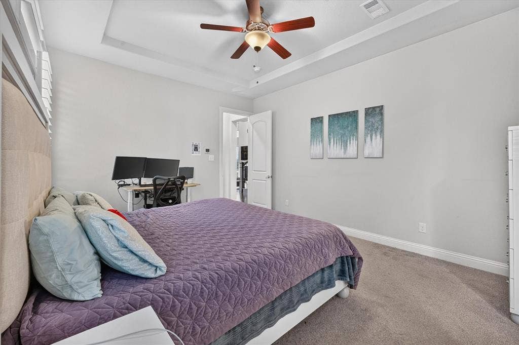 1416 White Squall Trail, Arlington, TX 76005 Tray ceiling with a ceiling fan, carpeted flooring, and white interior doors
