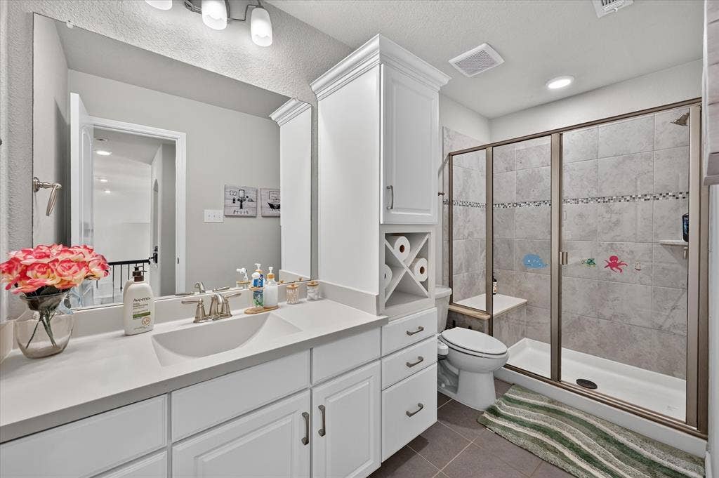 1416 White Squall Trail, Arlington, TX 76005 Dual vanity with integrated sinks, white cabinetry, and brushed nickel fixtures