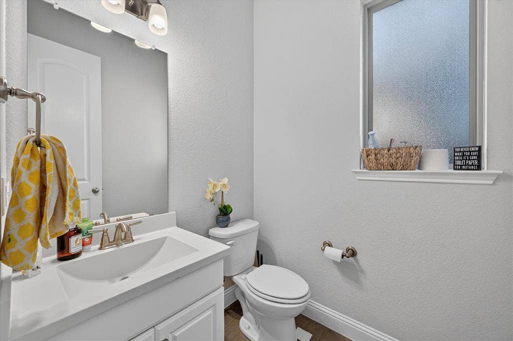 1416 White Squall Trail, Arlington, TX 76005 White vanity with an integrated sink and brushed nickel faucet