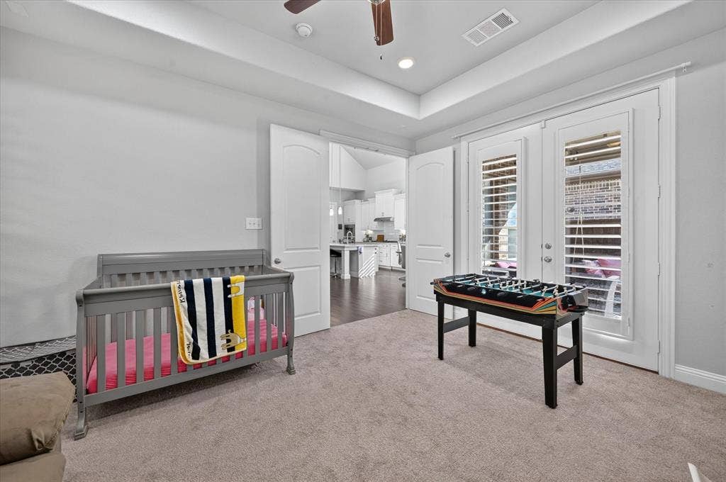 1416 White Squall Trail, Arlington, TX 76005 Recessed lighting, ceiling fan, double doors with interior shutters, and carpeted flooring