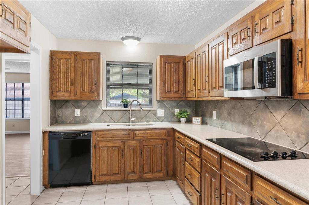 Electric cooktop, microwave and wall oven