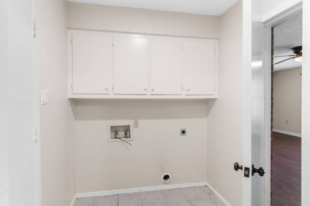 Just off the garage with upper cabinets
