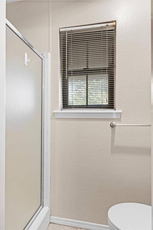 Primary suite has a shower that closes off from the vanity